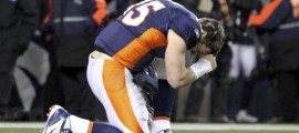 Denver Broncos quarterback Tim Tebow prays after the Broncos defeated the Pittsburgh Steelers in overtime in the NFL AFC wildcard playoff football game in Denver